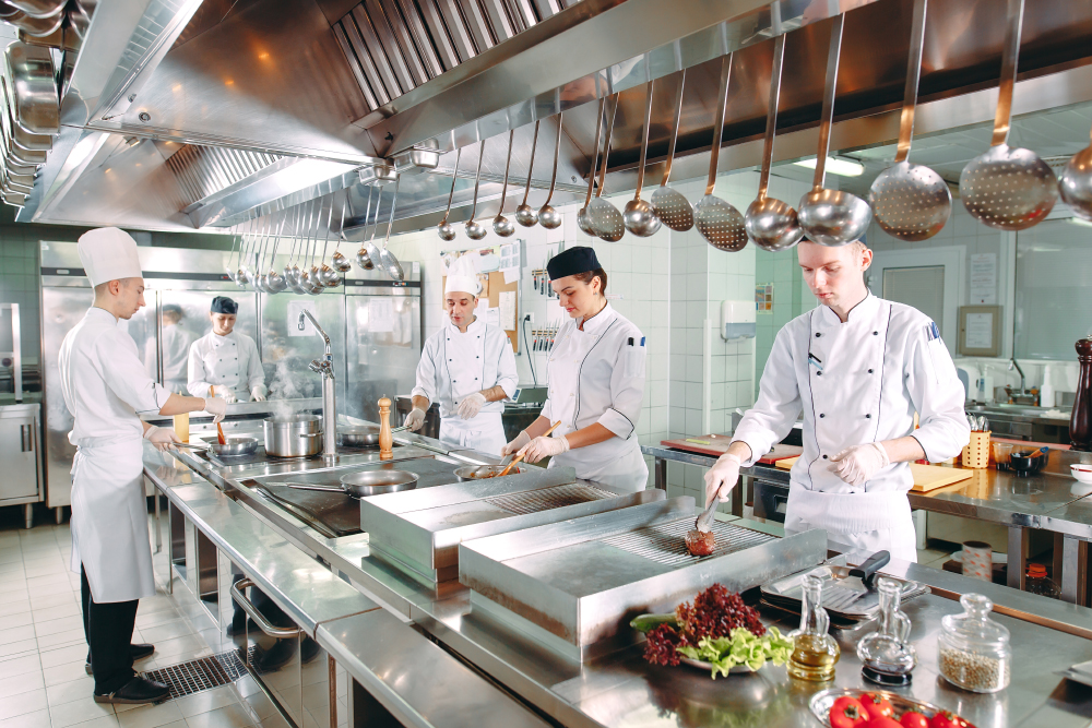 Modern kitchen. The chefs prepare meals in the restaurant's kitchen.